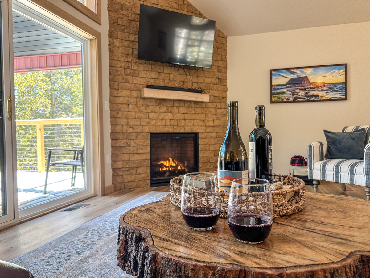 two glasses of wine on a table in a living room