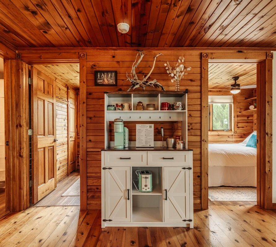 Coffee station with teal Keurig, coffee pods, and tea accessories