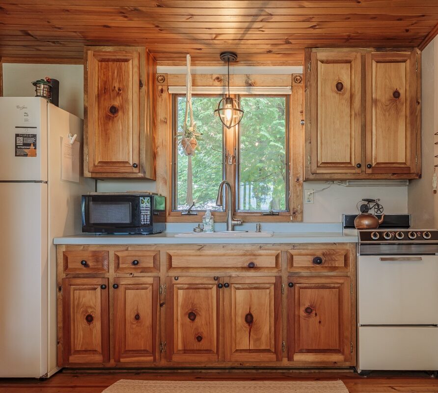 Open kitchen with full amenities including stove, fridge, and microwave