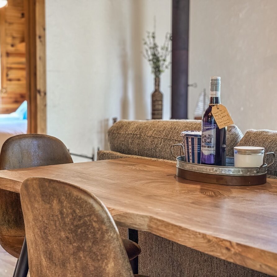 Dining area with a welcome bottle of local Door County wine